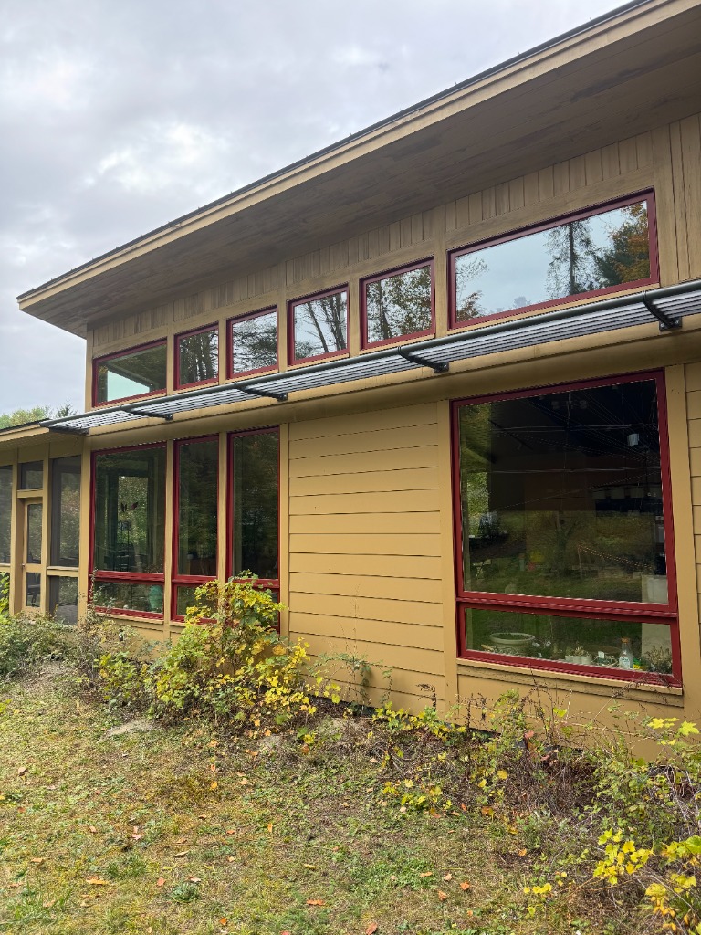 Modern home with red trim windows